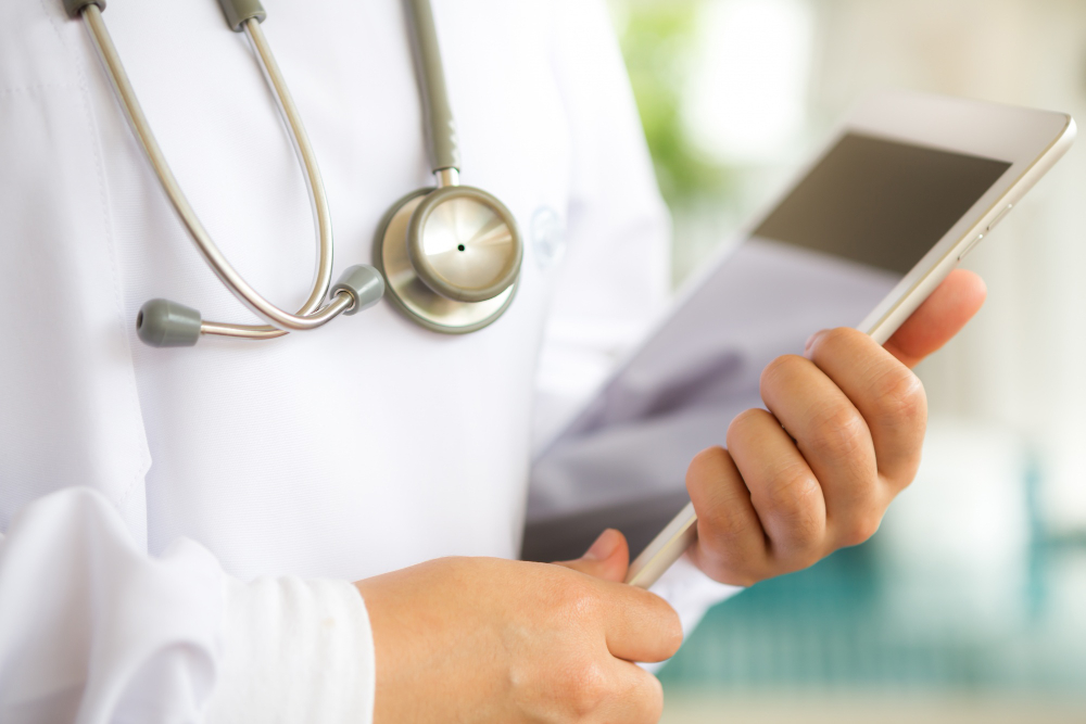 close-up-physician-holding-tablet