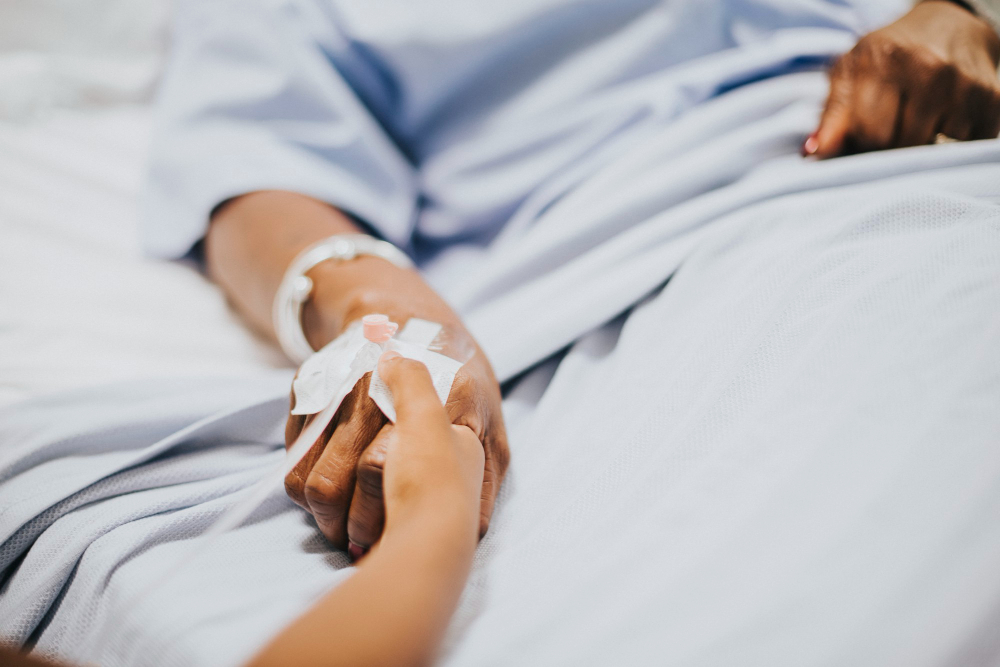 daughter-holding-her-mothers-hand-hospital