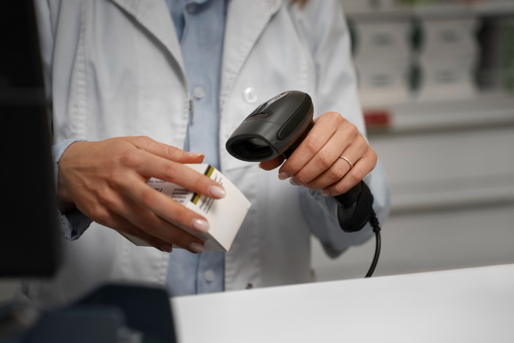 female-pharmacist-scanning-medicine-counter